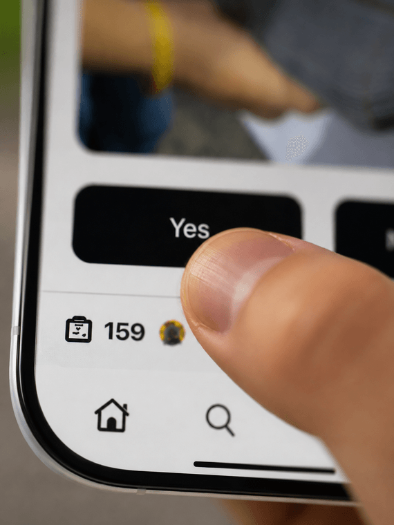 Thumb pressing a Tapnudge vote button